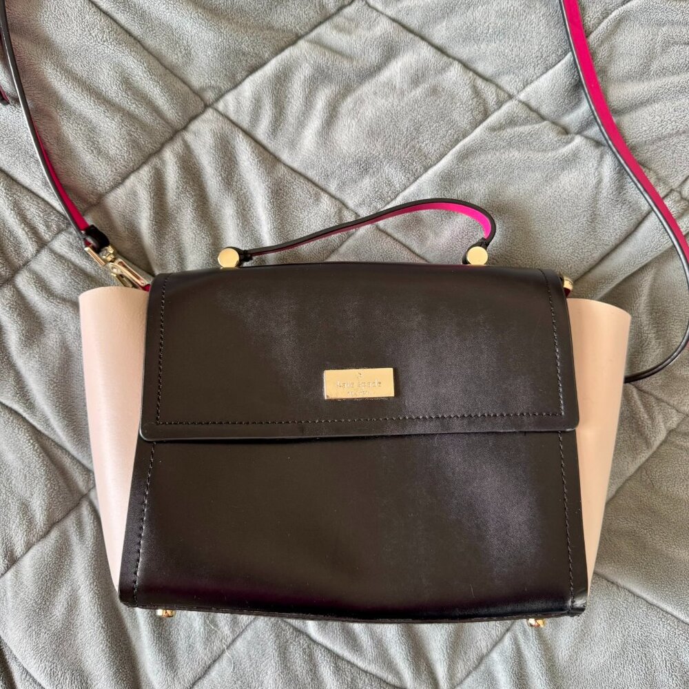 Kate Spade black & white leather crossbody bag w/ hot pink interior, 10"w x 7"h
